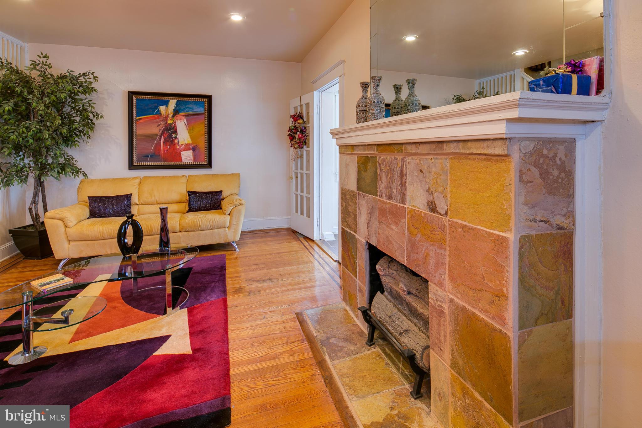 5001 Levindale Road Baltimore, MD 21215 - Photo 3 of 20 a view of a living room with furniture and a potted plant
