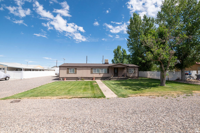 855 East 300 N Street Beaver, UT 84713 - Photo 2 of 44 Single-story property featuring a neutral-toned exterior and a dark roof