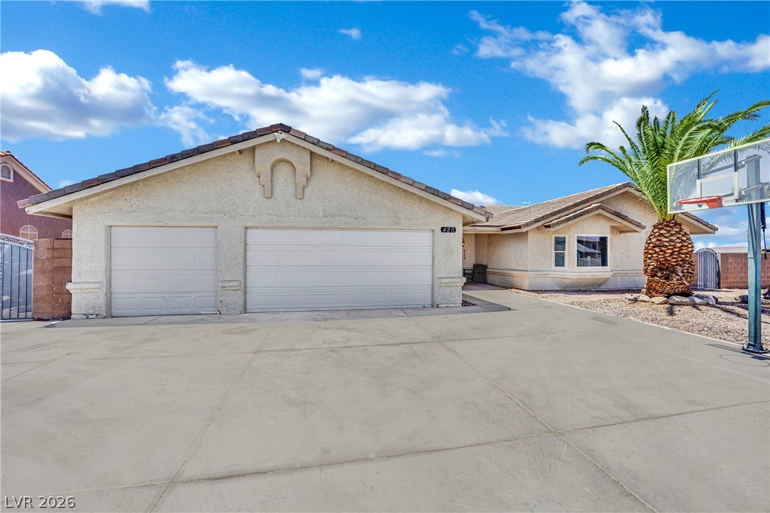 420 North Racetrack Road Henderson, NV 89015 - Photo 4 of 52 A well-maintained stucco facade with an attached two-car garage welcomes you home.