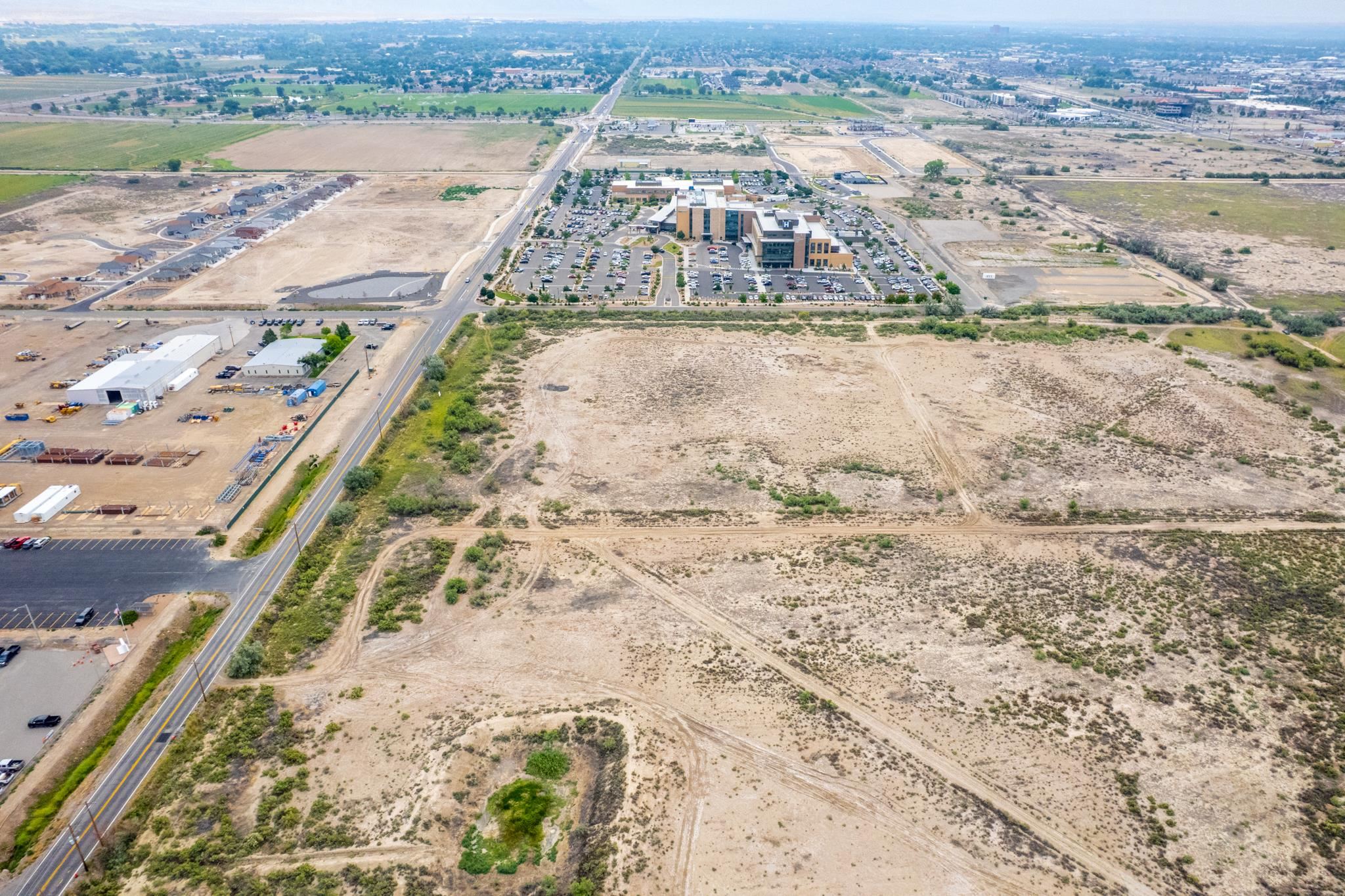 699 23 1/2 Road Grand Junction, CO 81505 - Photo 5 of 12 an aerial view of residential houses with outdoor space