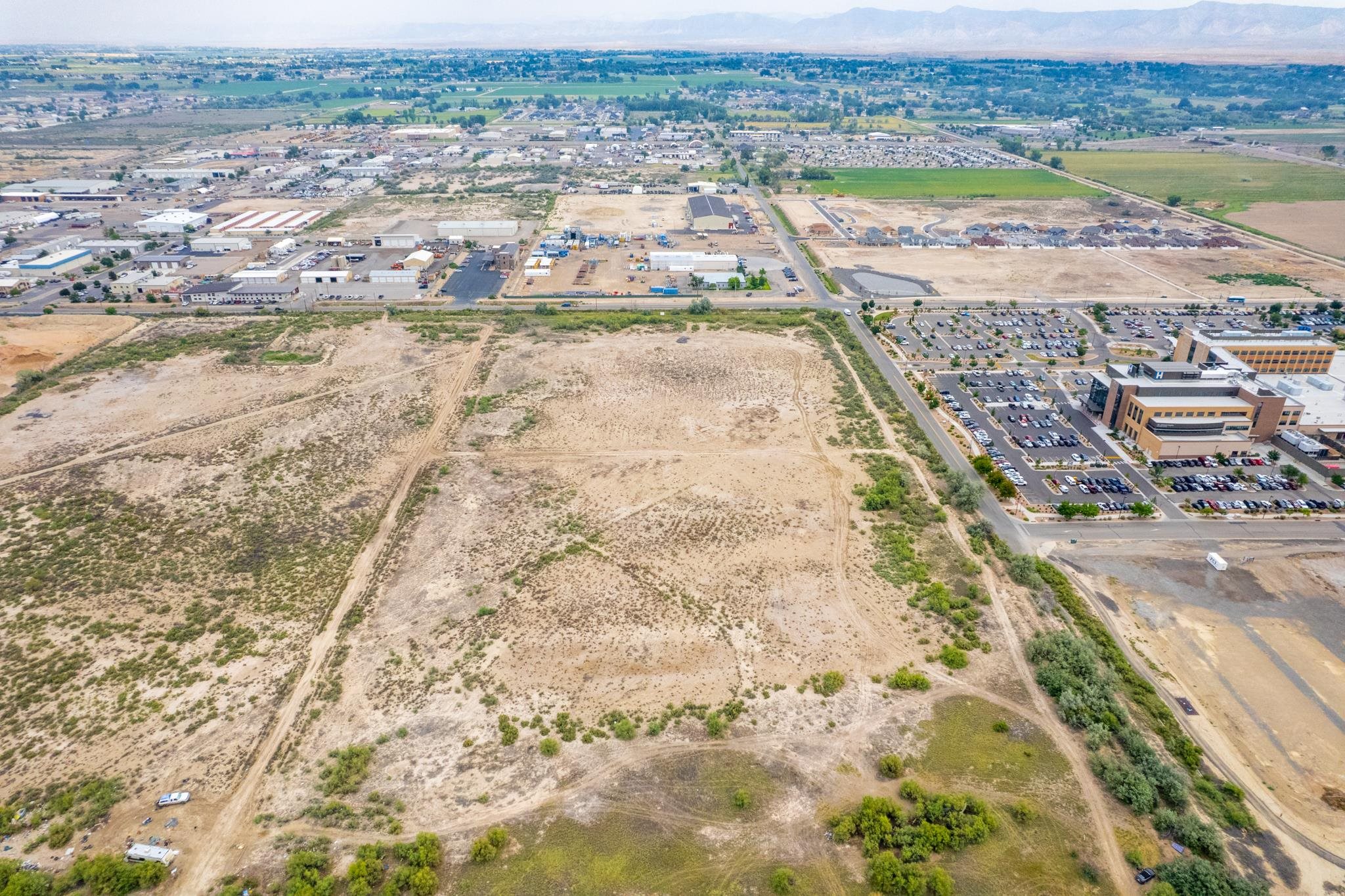 699 23 1/2 Road Grand Junction, CO 81505 - Photo 6 of 12 an aerial view of residential houses with outdoor space