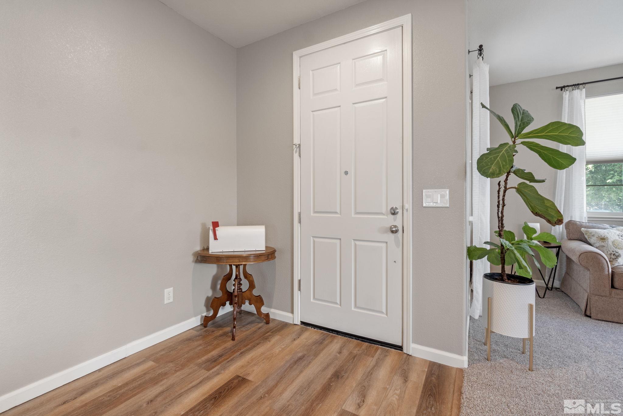 420 Stradella Court Reno, NV 89521 - Photo 16 of 40 a view of an entryway with wooden floor