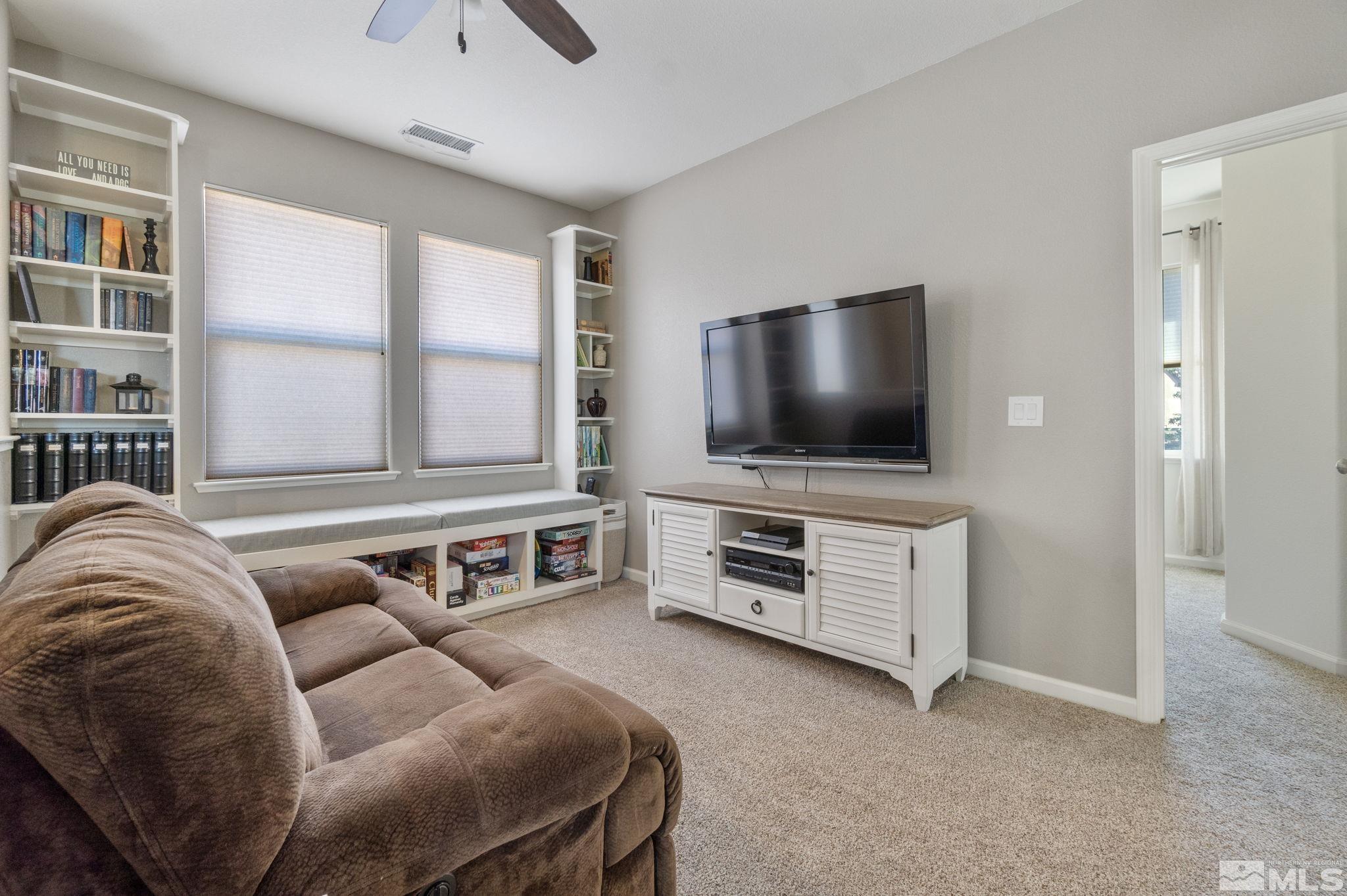 420 Stradella Court Reno, NV 89521 - Photo 20 of 40 a living room with furniture and a flat screen tv