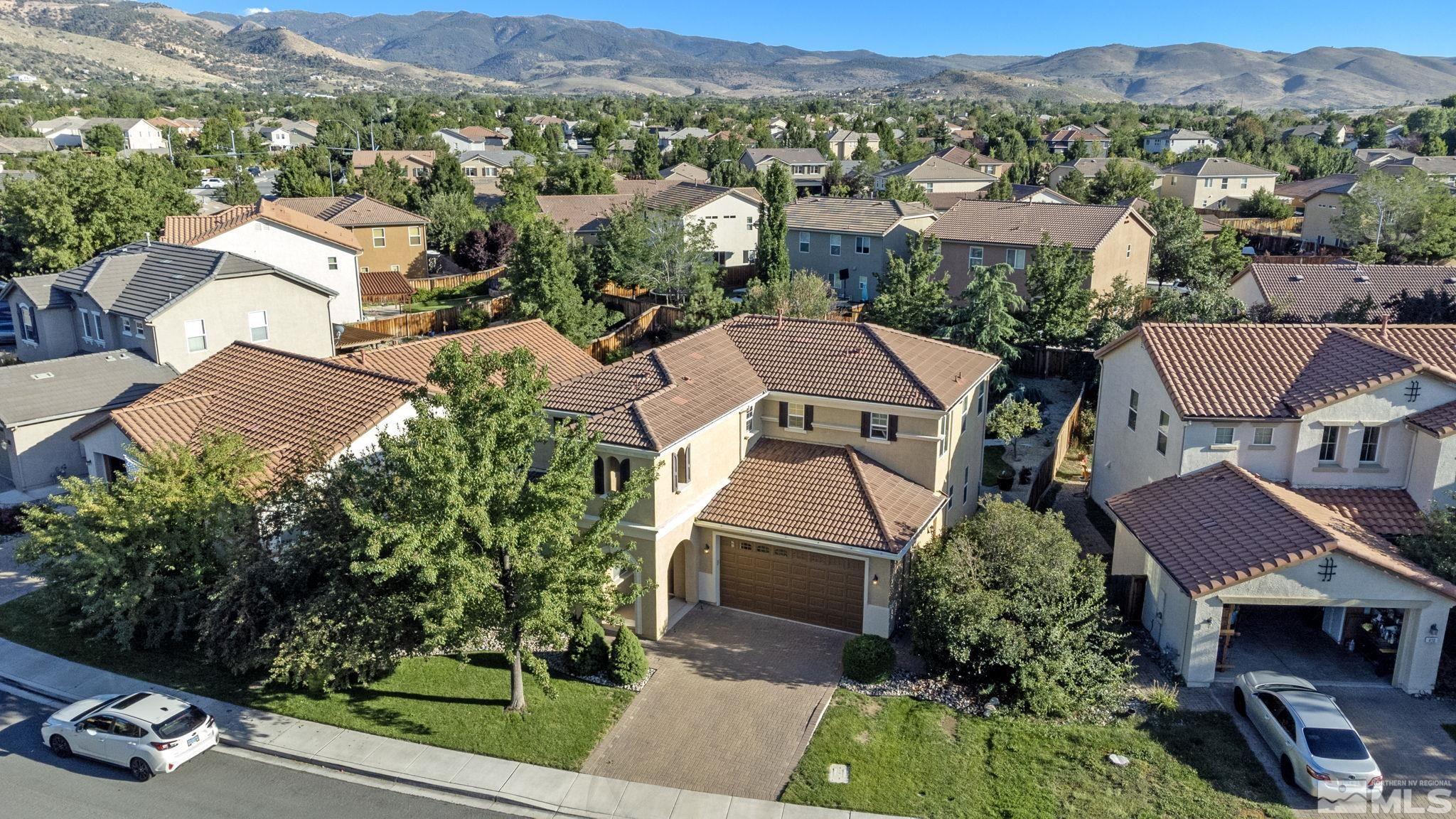 420 Stradella Court Reno, NV 89521 - Photo 30 of 40 an aerial view of multiple houses with a yard