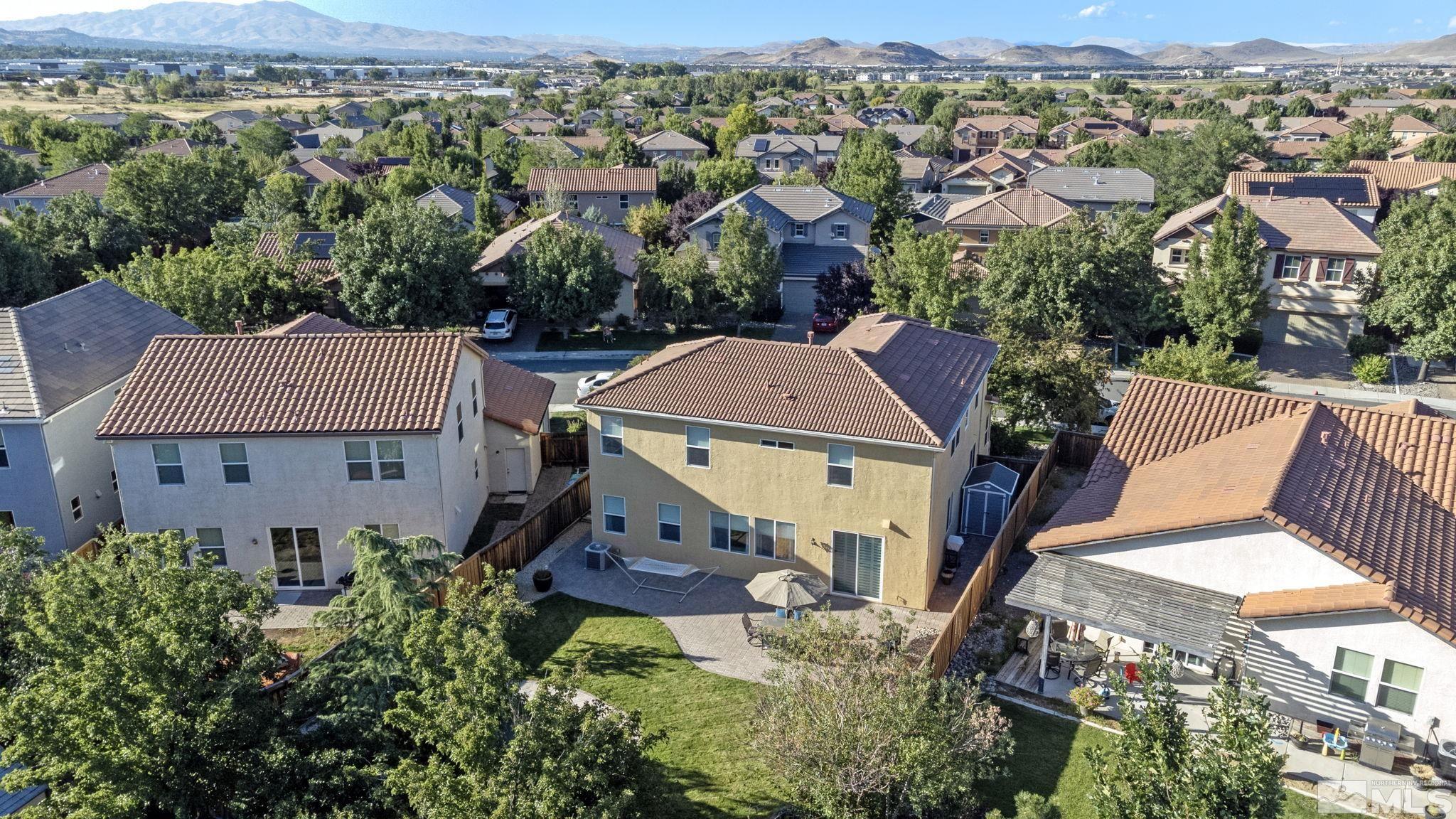420 Stradella Court Reno, NV 89521 - Photo 32 of 40 an aerial view of multiple houses with a yard