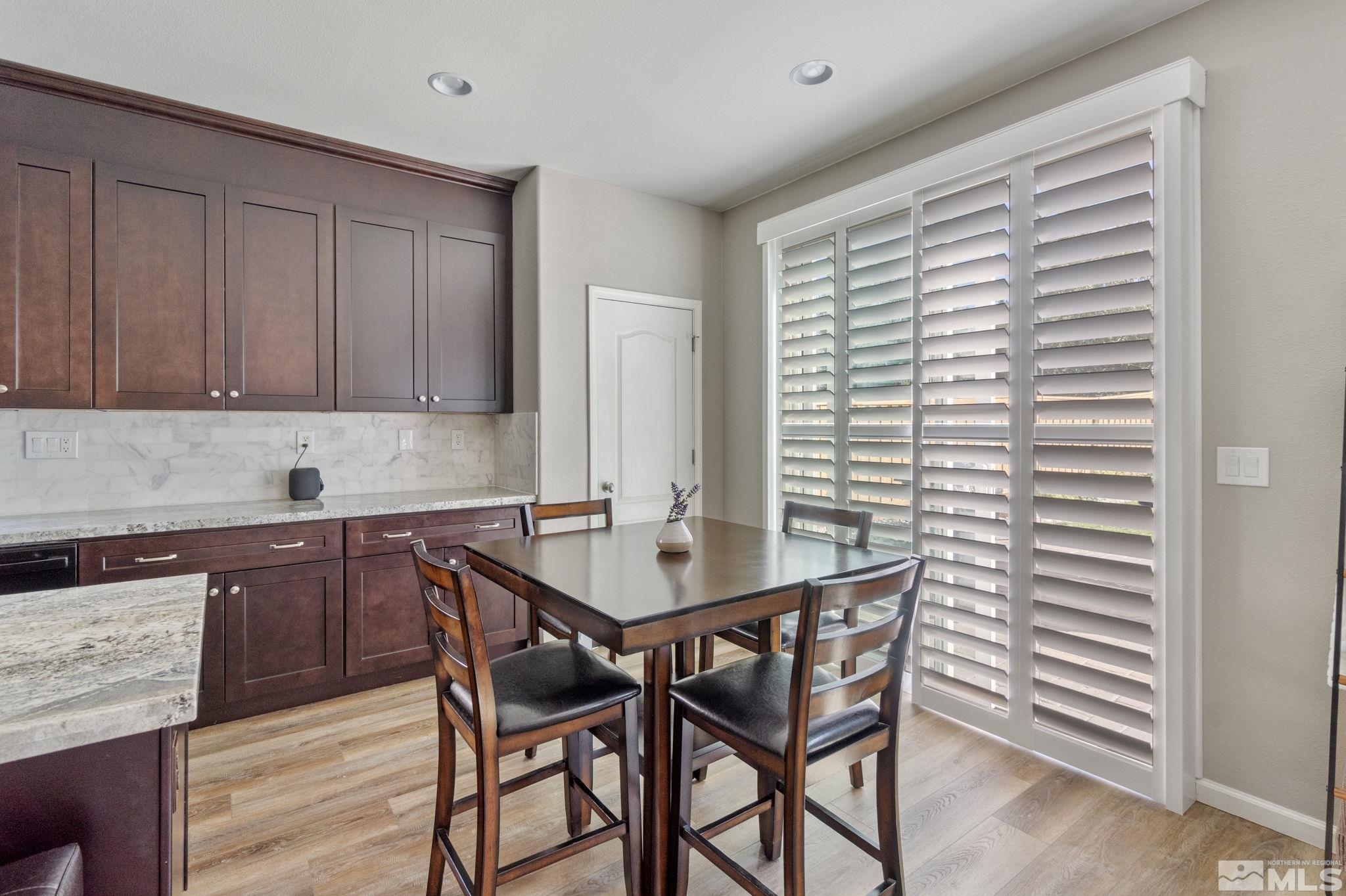 420 Stradella Court Reno, NV 89521 - Photo 8 of 40 a kitchen with a table and chairs in it