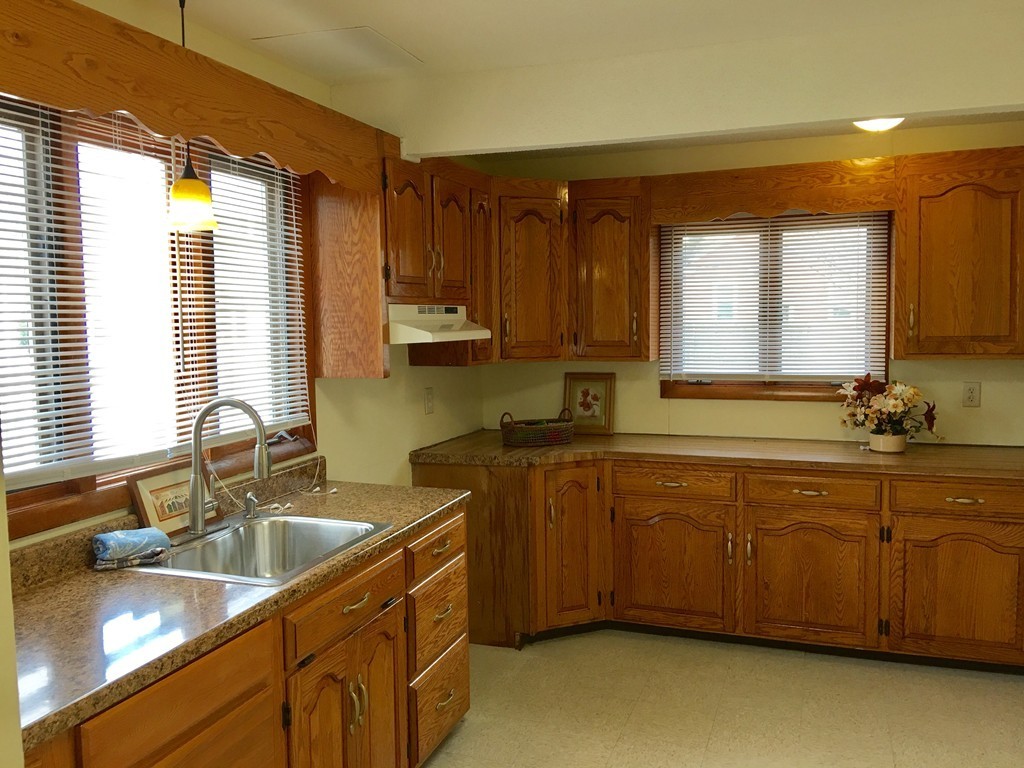 11 Bushwick Place Springfield, MA 01109 - Photo 2 of 13 a kitchen with granite countertop a sink stove and cabinets