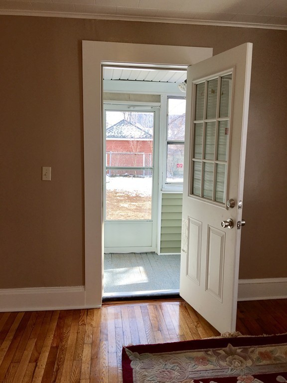 11 Bushwick Place Springfield, MA 01109 - Photo 6 of 13 a view of an empty room with wooden floor and a window