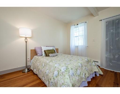 31 Taft Road Sterling, MA 01564 - Photo 16 of 23 a bedroom with a bed and a night stand