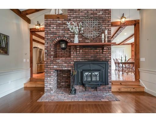 31 Taft Road Sterling, MA 01564 - Photo 5 of 23 a living room with furniture a fireplace and a wooden floor