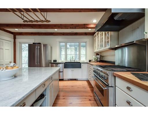 31 Taft Road Sterling, MA 01564 - Photo 6 of 23 a kitchen with stainless steel appliances granite countertop a sink stove and cabinets