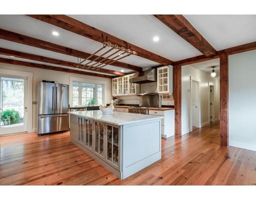 31 Taft Road Sterling, MA 01564 - Photo 7 of 23 a open kitchen with stainless steel appliances granite countertop a stove and a refrigerator