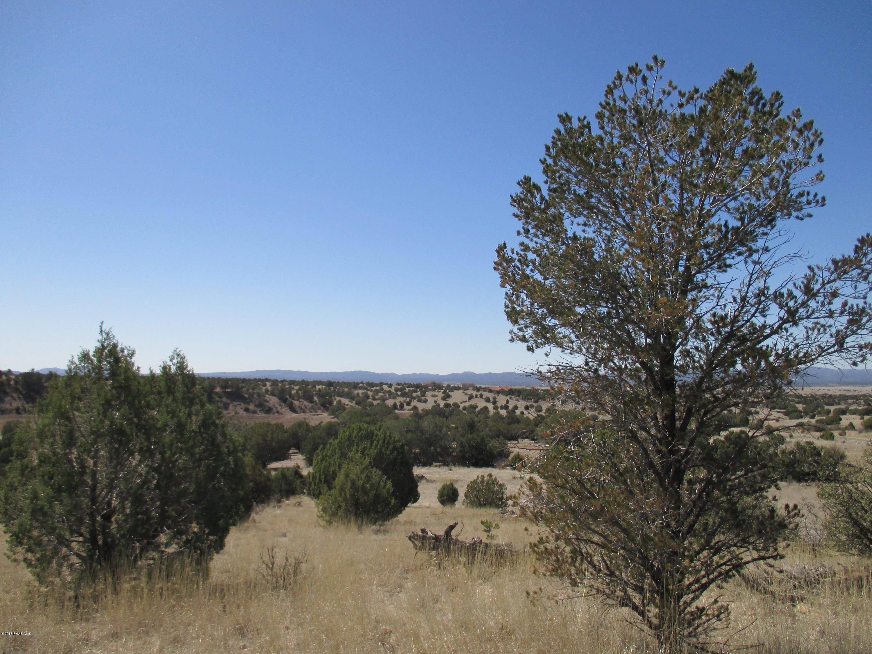 17801 Crossroads Ranch Road Prescott, AZ 86305 - Photo 1 of 13 a view of a terrace with a bench