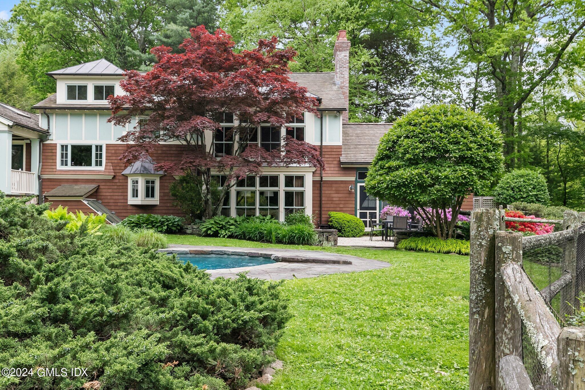 306 Stanwich Road Greenwich, CT 06830 - Photo 26 of 87 a view of a house with a yard