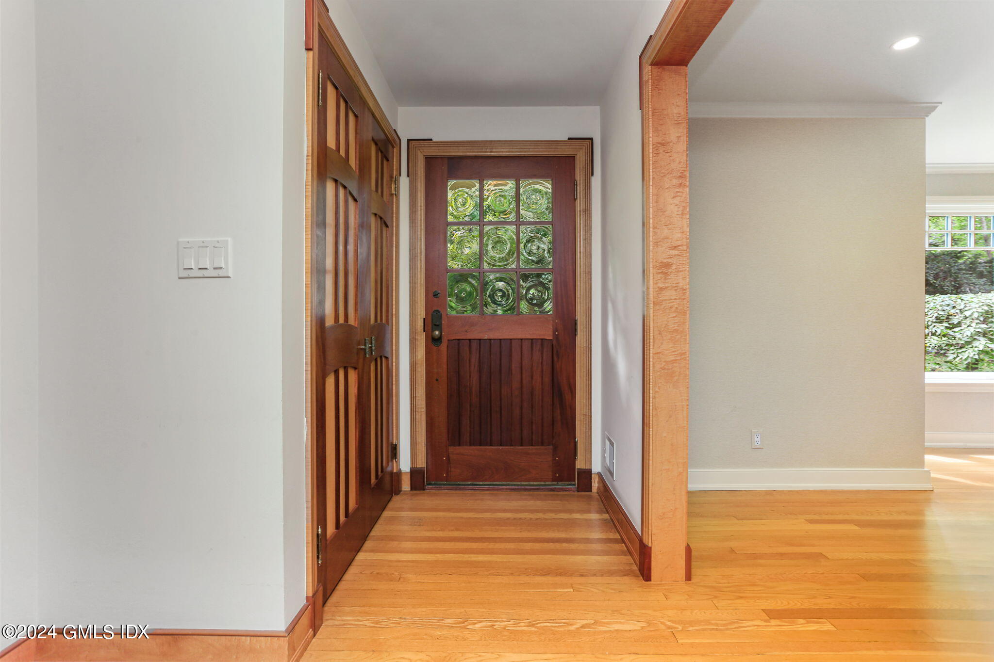 306 Stanwich Road Greenwich, CT 06830 - Photo 47 of 87 a view of a hallway with wooden floor and a bathroom