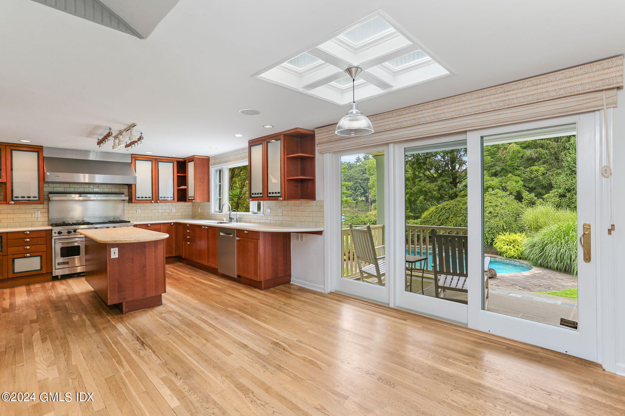 306 Stanwich Road Greenwich, CT 06830 - Photo 58 of 87 a large kitchen with stainless steel appliances granite countertop a stove and a wooden floors