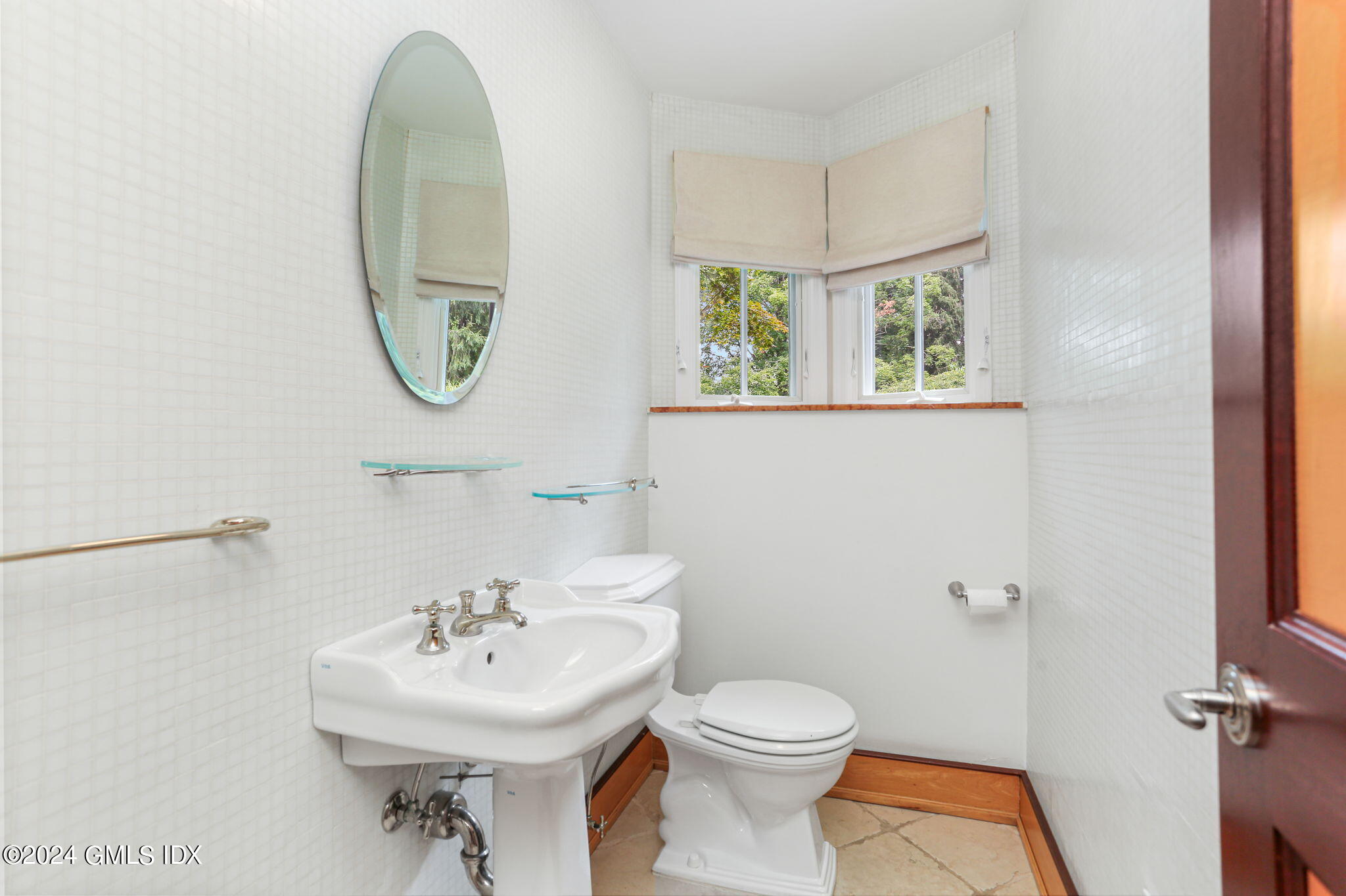 306 Stanwich Road Greenwich, CT 06830 - Photo 76 of 87 a bathroom with a sink a toilet and a mirror