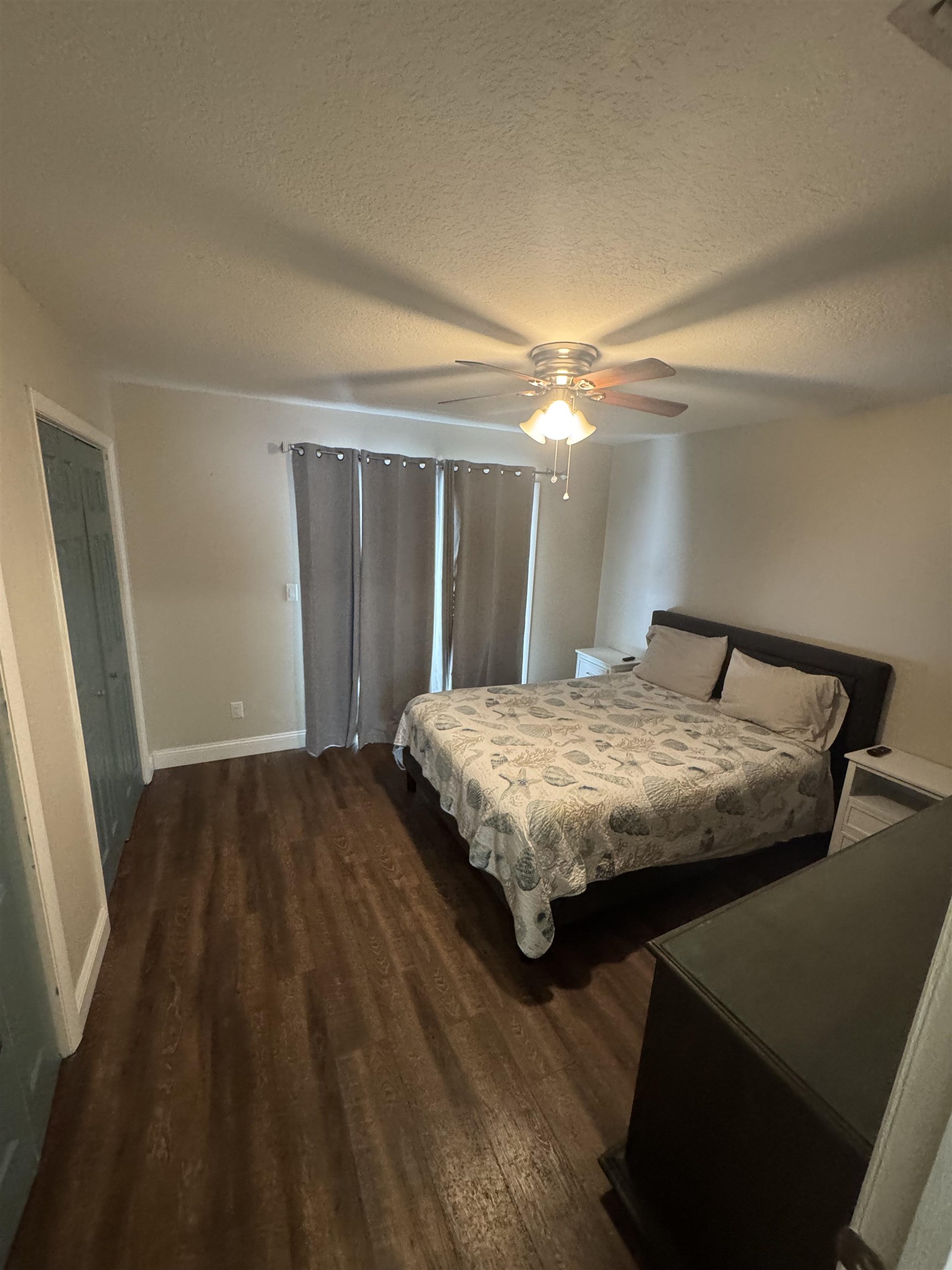 202 E Street, Unit A St. Augustine, FL 32080 - Photo 19 of 22 a bedroom with a bed and a mirror