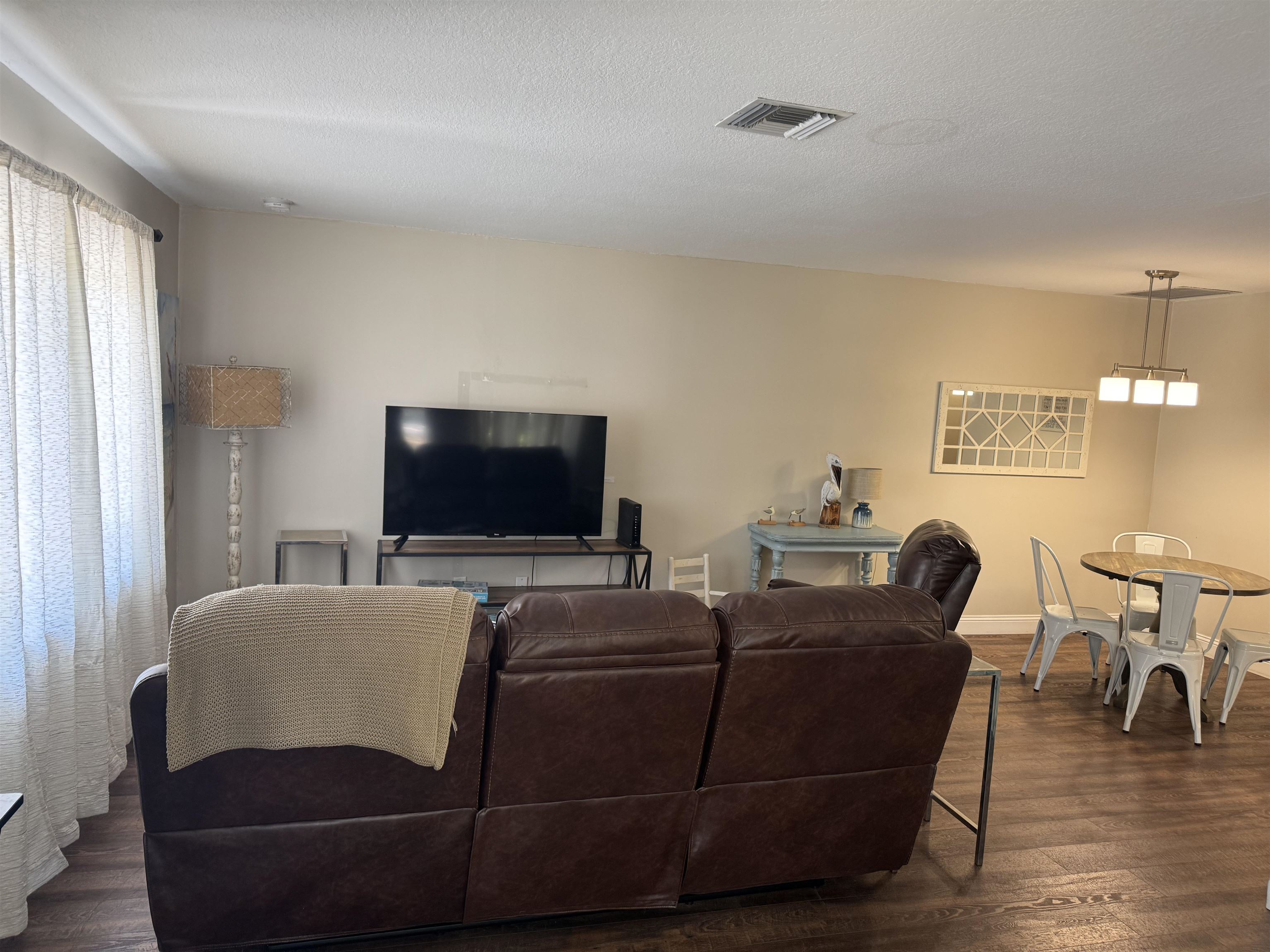 202 E Street, Unit A St. Augustine, FL 32080 - Photo 22 of 22 a living room with furniture and a flat screen tv
