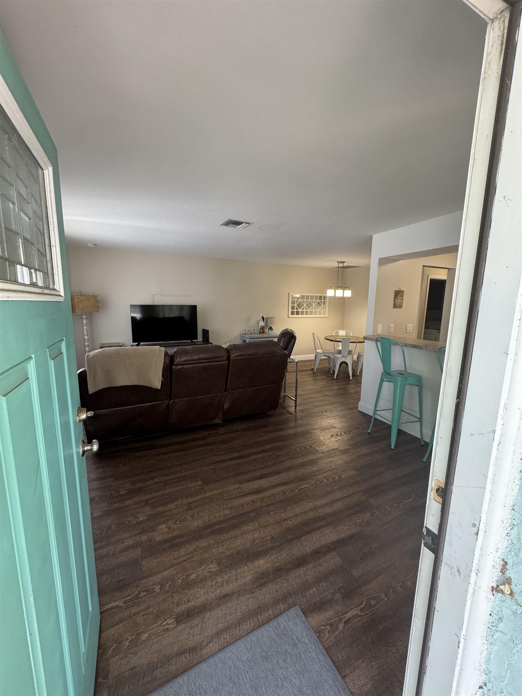 202 E Street, Unit A St. Augustine, FL 32080 - Photo 5 of 22 a living room with furniture and a wooden floor