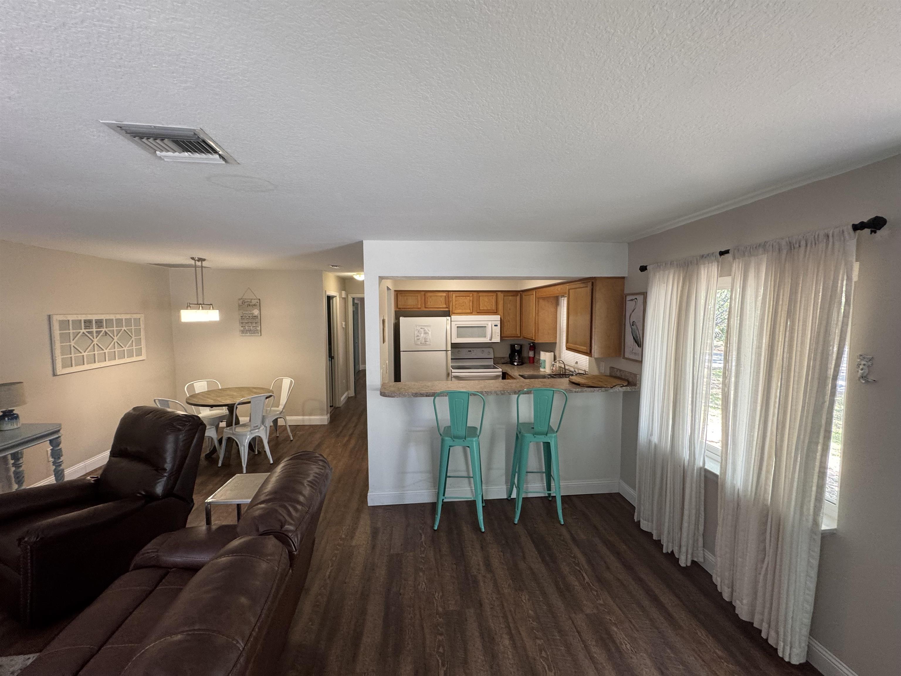 202 E Street, Unit A St. Augustine, FL 32080 - Photo 6 of 22 a view of hallway with furniture and wooden floor