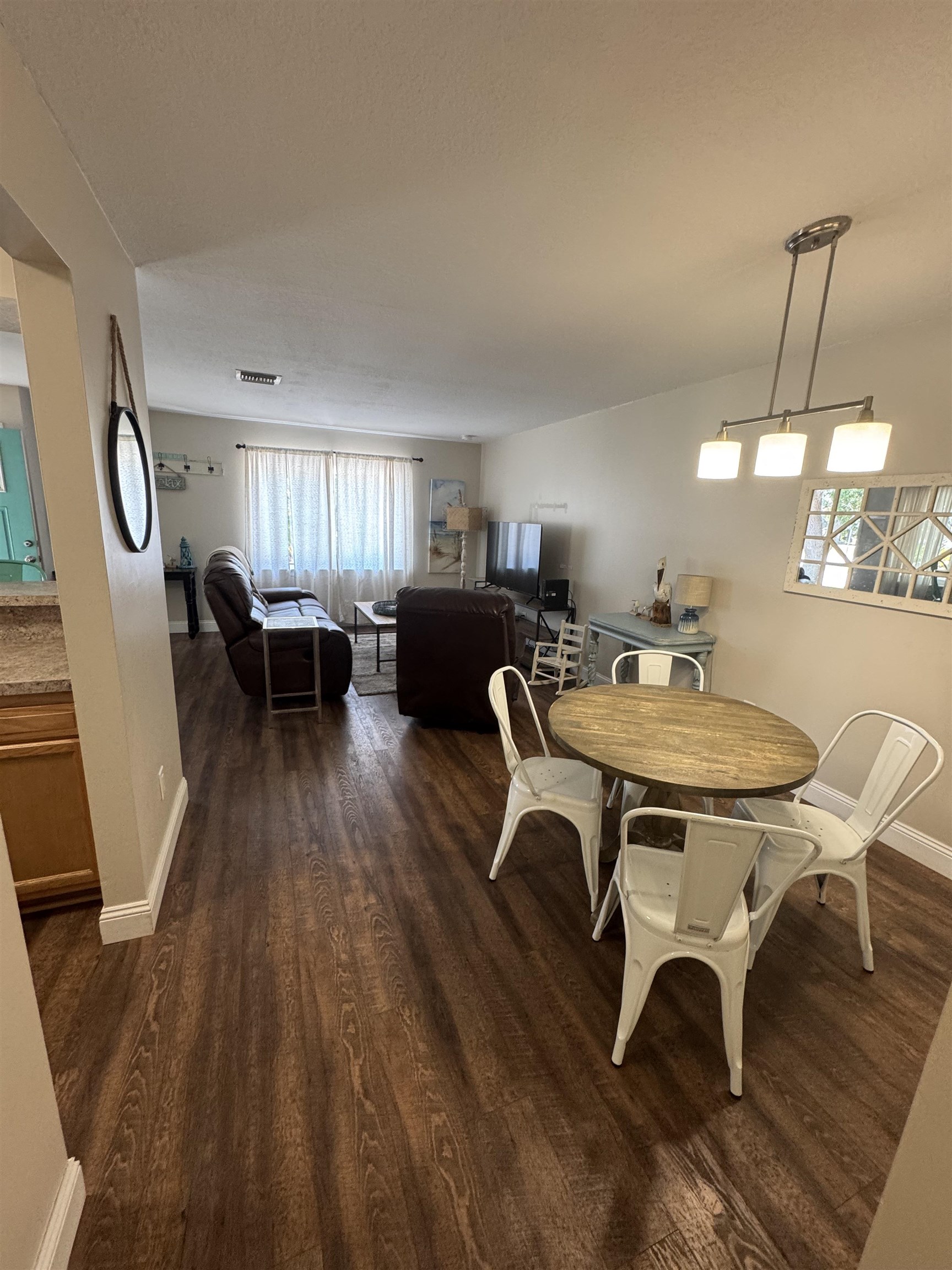202 E Street, Unit A St. Augustine, FL 32080 - Photo 10 of 22 a view of a dining room with furniture window and wooden floor
