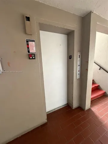 an outdoor space with swimming pool and furniture