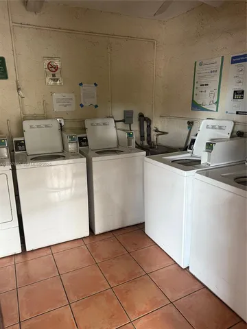 a view of a park with a slide and swing