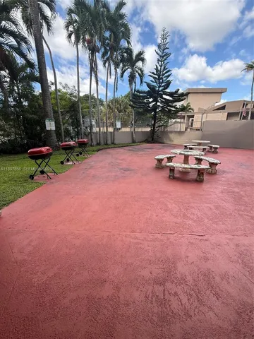 a view of swimming pool with outdoor seating