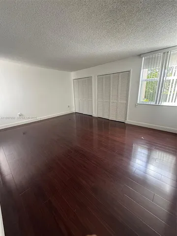a view of a utility room with windows