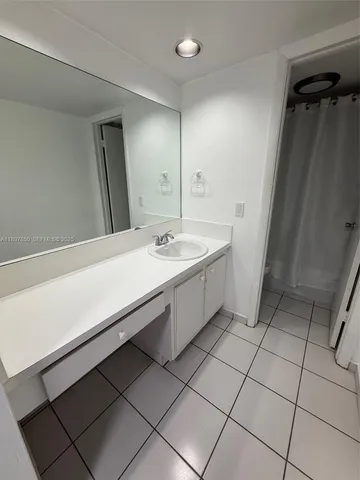 a bathroom with a toilet and a bathtub