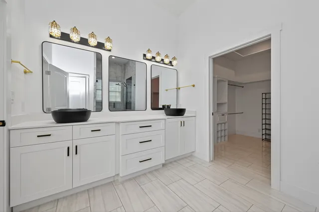 a bedroom with a bed couches and window