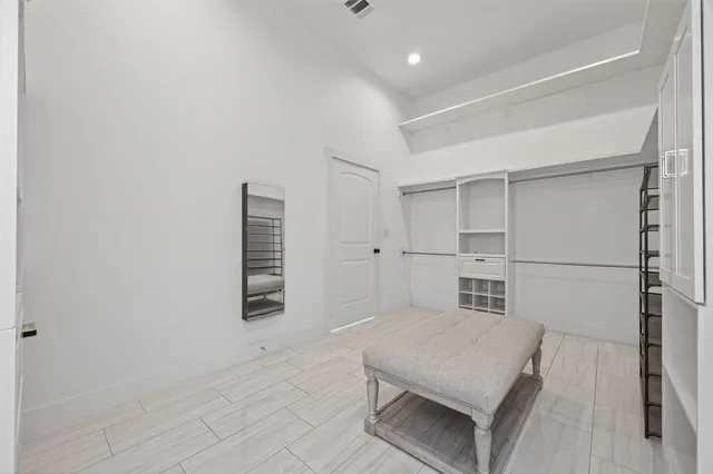 a view of a livingroom with a ceiling fan and wooden floor