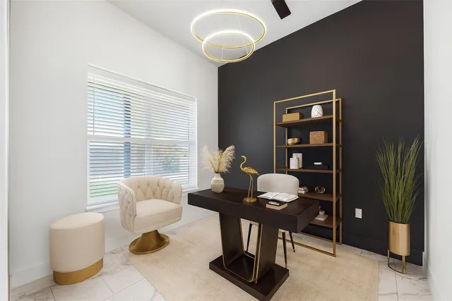 a living room with furniture and a view of kitchen