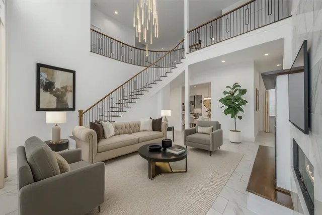 a kitchen with stainless steel appliances a stove a sink and a refrigerator