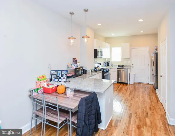 a bedroom with furniture and a flat screen tv