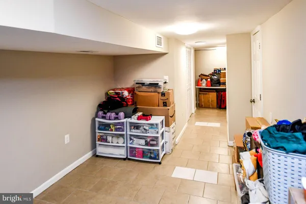a room with furniture and musical instruments