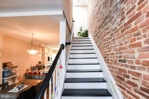 a view of a balcony with a potted plant