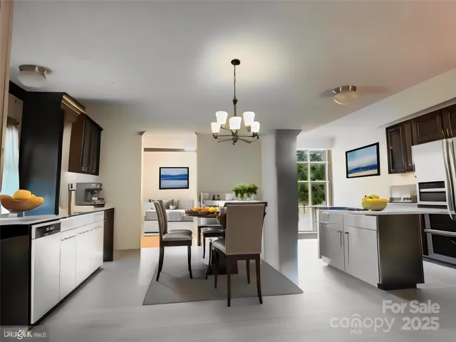 a view of a dining room with furniture and a chandelier