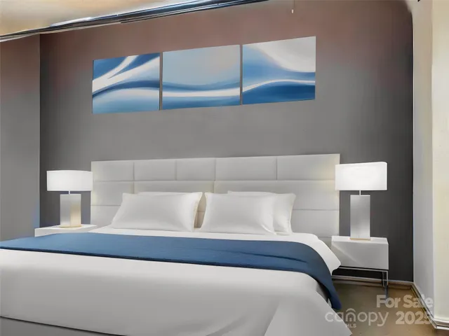 a bedroom with a bed and a night stand