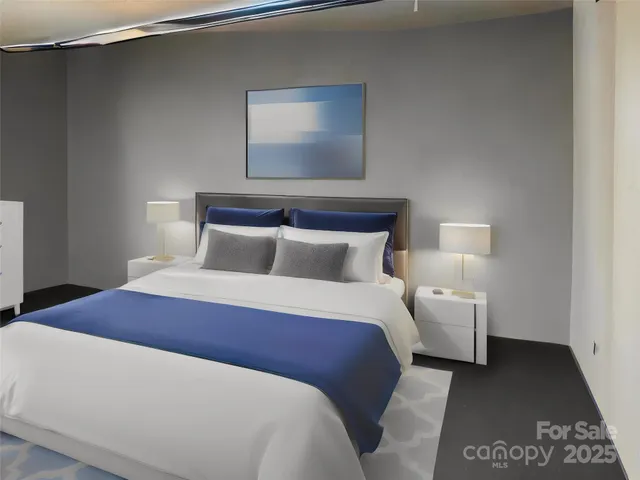 a bedroom with a bed and a night stand