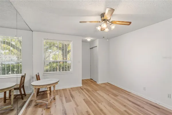 a view of a livingroom with furniture window and wooden floor