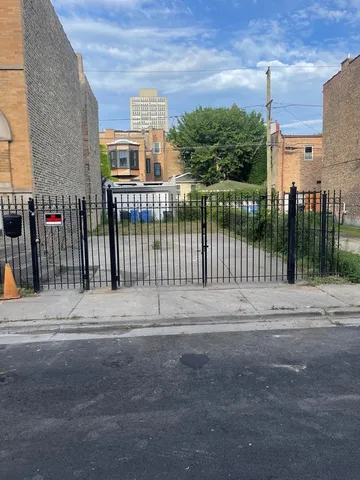 a view of a street with a building in the background