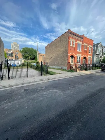 a view of a street with a building in the background