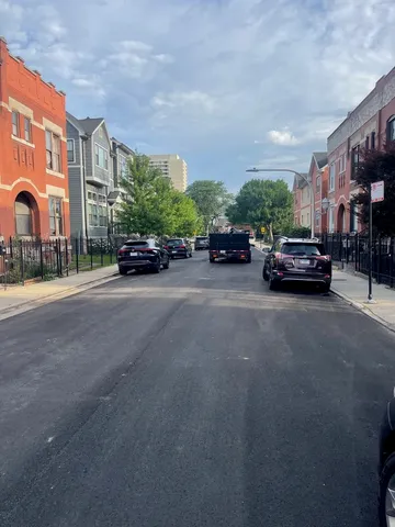 a view of street with parked cars