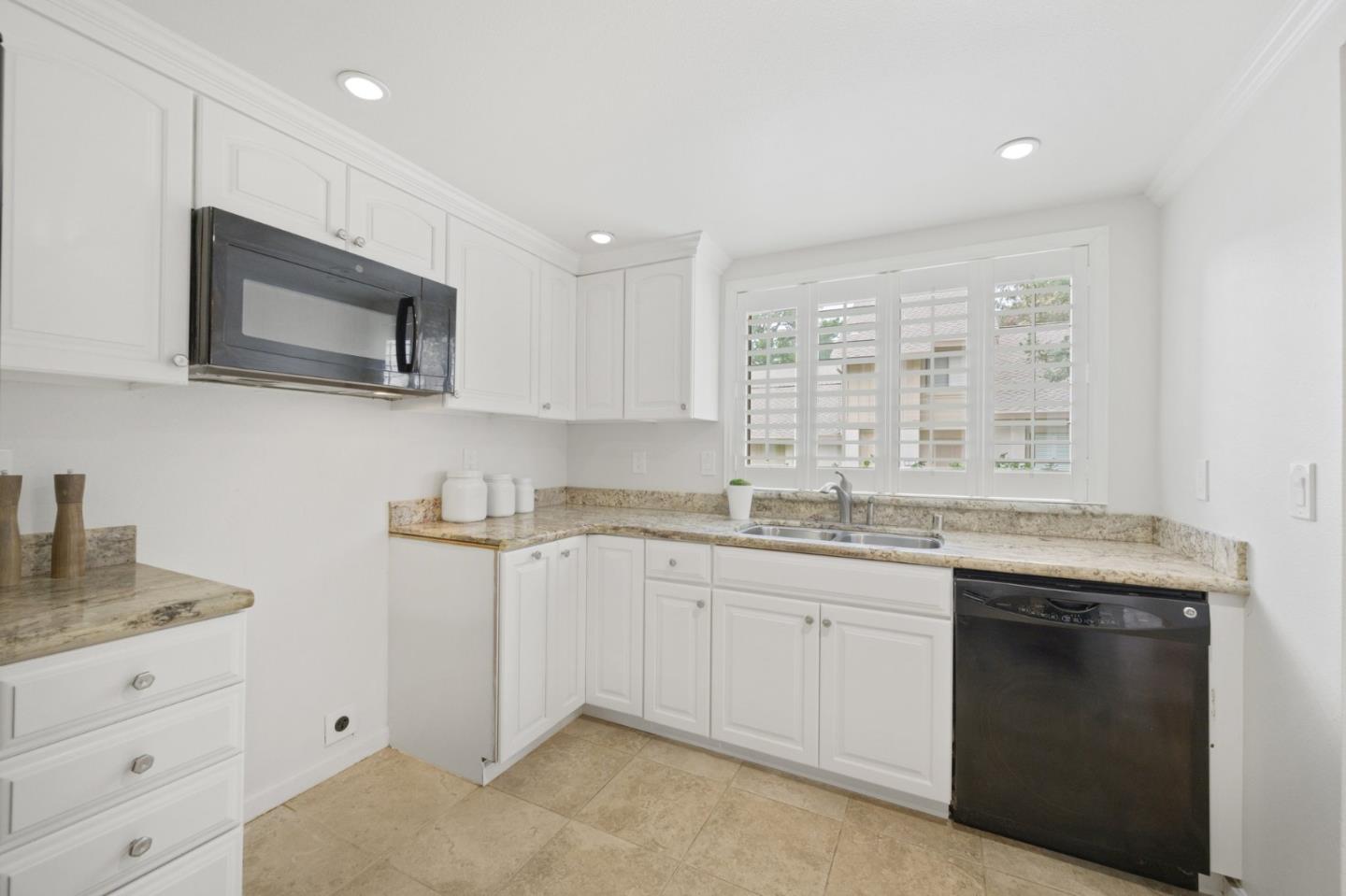 446 Hogarth Terrace Sunnyvale, CA 94087 - Photo 13 of 36 a kitchen with granite countertop sink stainless steel appliances and cabinets