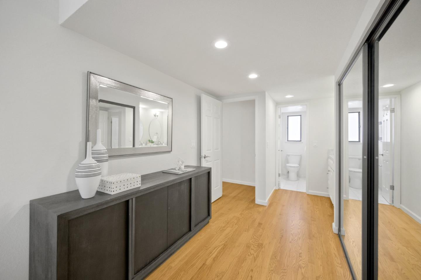 446 Hogarth Terrace Sunnyvale, CA 94087 - Photo 20 of 36 a spacious bathroom with a granite countertop sink a mirror and a bathtub