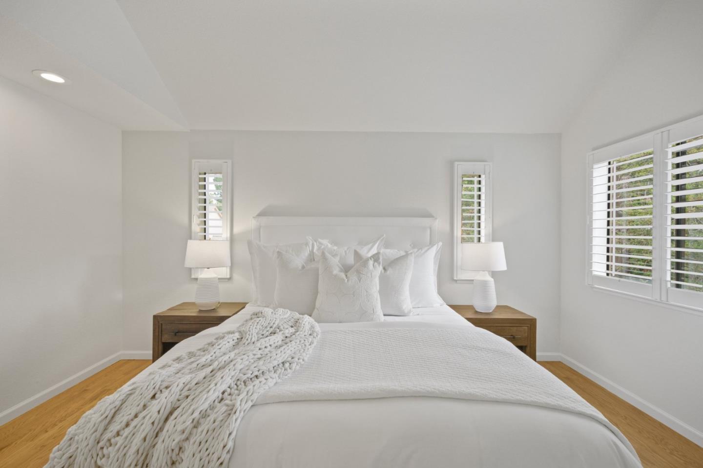 446 Hogarth Terrace Sunnyvale, CA 94087 - Photo 22 of 36 a bedroom with a bed and a night stand