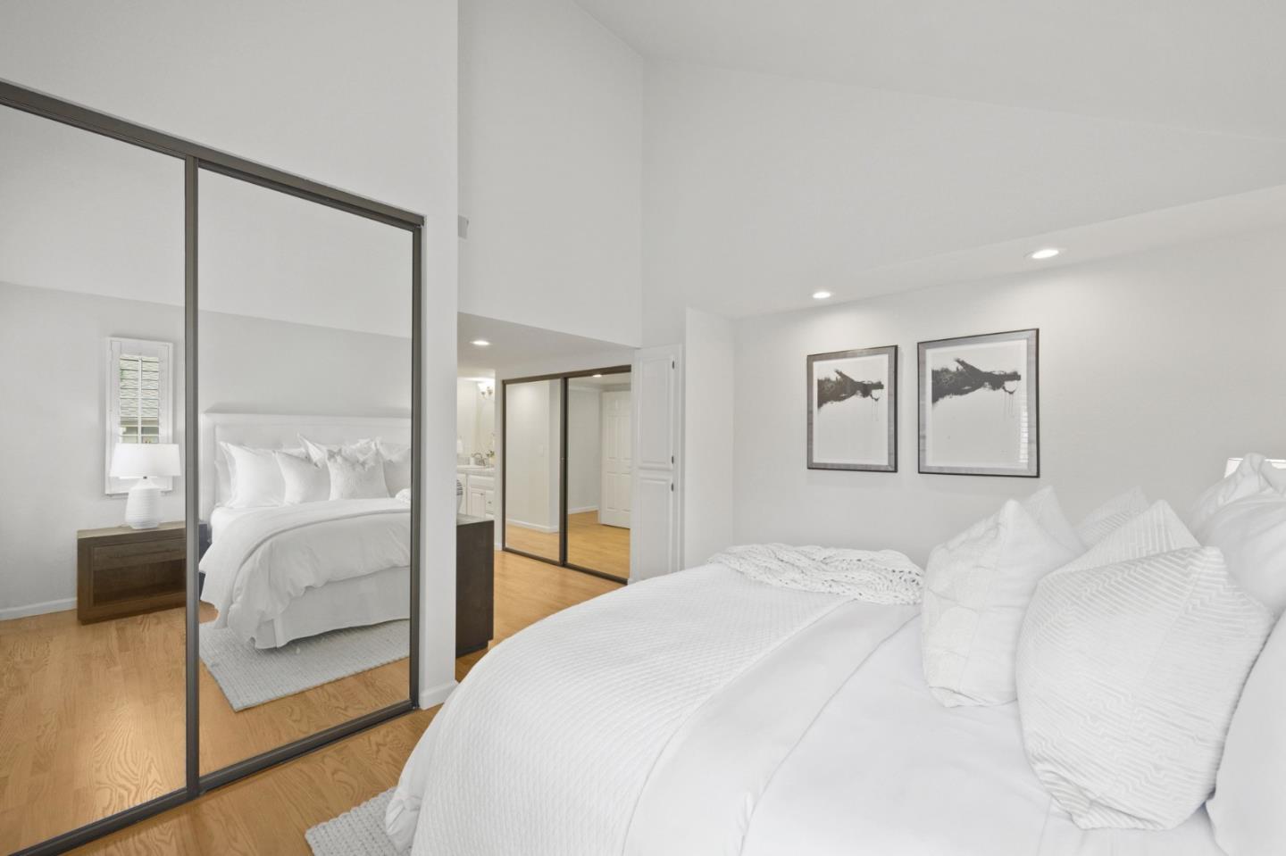 446 Hogarth Terrace Sunnyvale, CA 94087 - Photo 24 of 36 a bedroom with a large bed and a large mirror