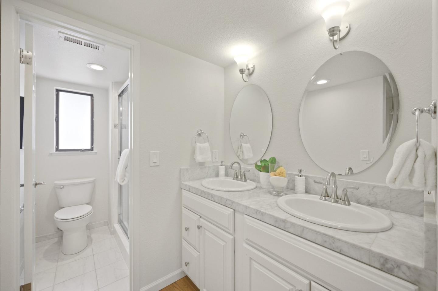 446 Hogarth Terrace Sunnyvale, CA 94087 - Photo 25 of 36 a bathroom with 2 sink and a mirror